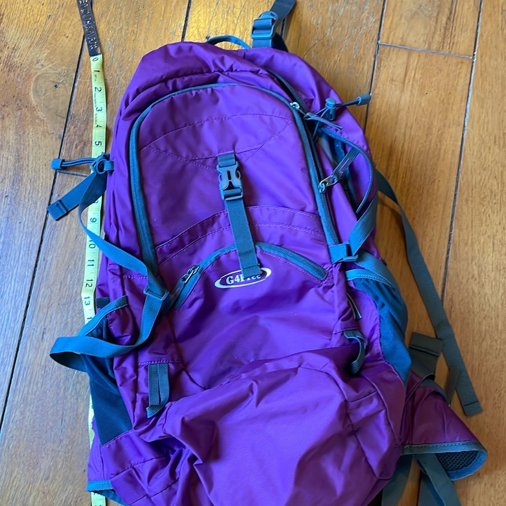 NWOT backpack, hip/waist belt, chest strap, waterproof cover, 45L